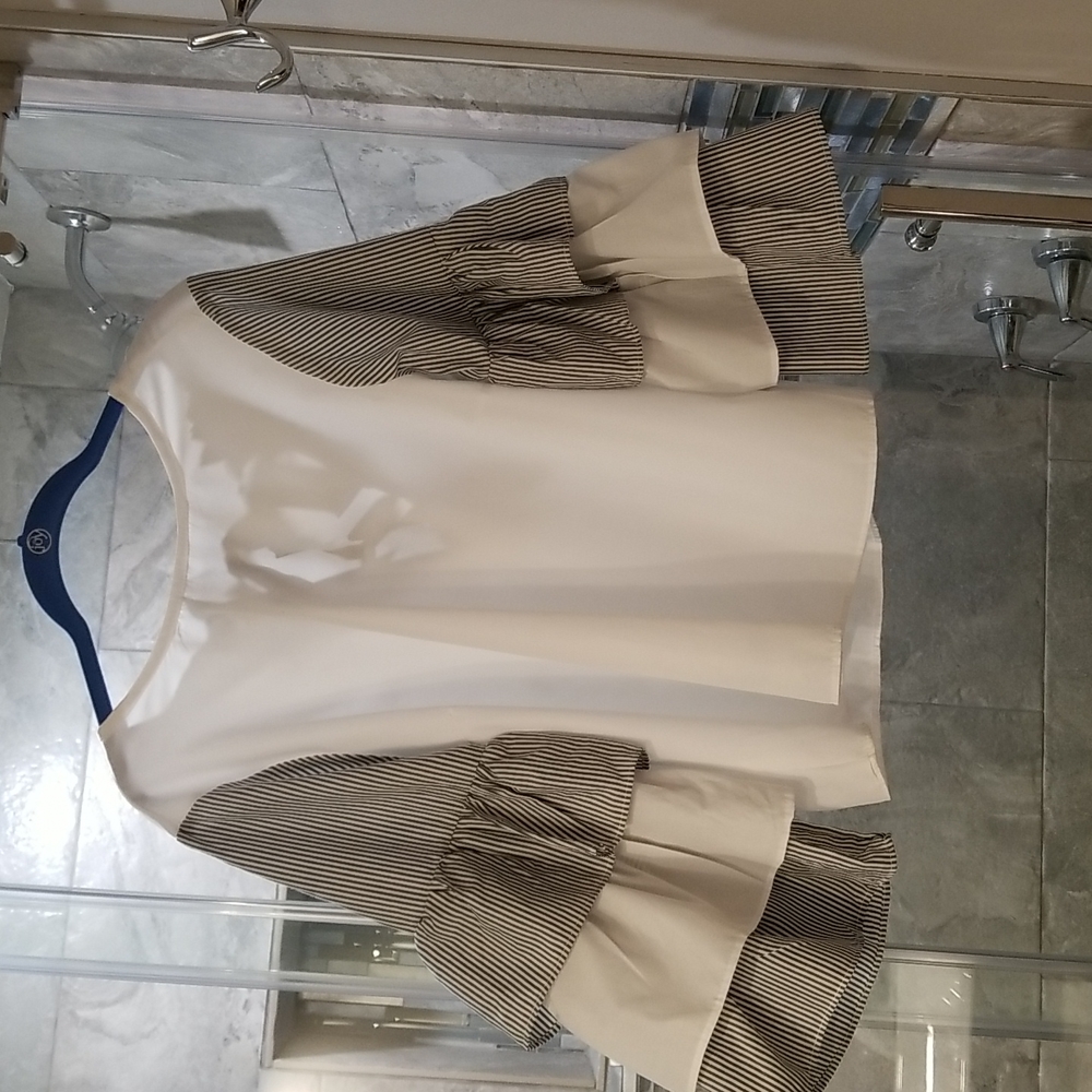 White blouse with black and white stripe sleeves. Size Meduim